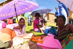 Basotho women await immunizations for their infants outside a sunny, rural clinic. (Photo: mjj)