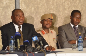 Cyril Ramaphosa, with Lt. Gen. Kamoli and Brigadier Mahao, as the SADC mediator answered a question at the Oct. 23, 2014, signing of the SADC security deal. (Photo by Michael J. Jordan)